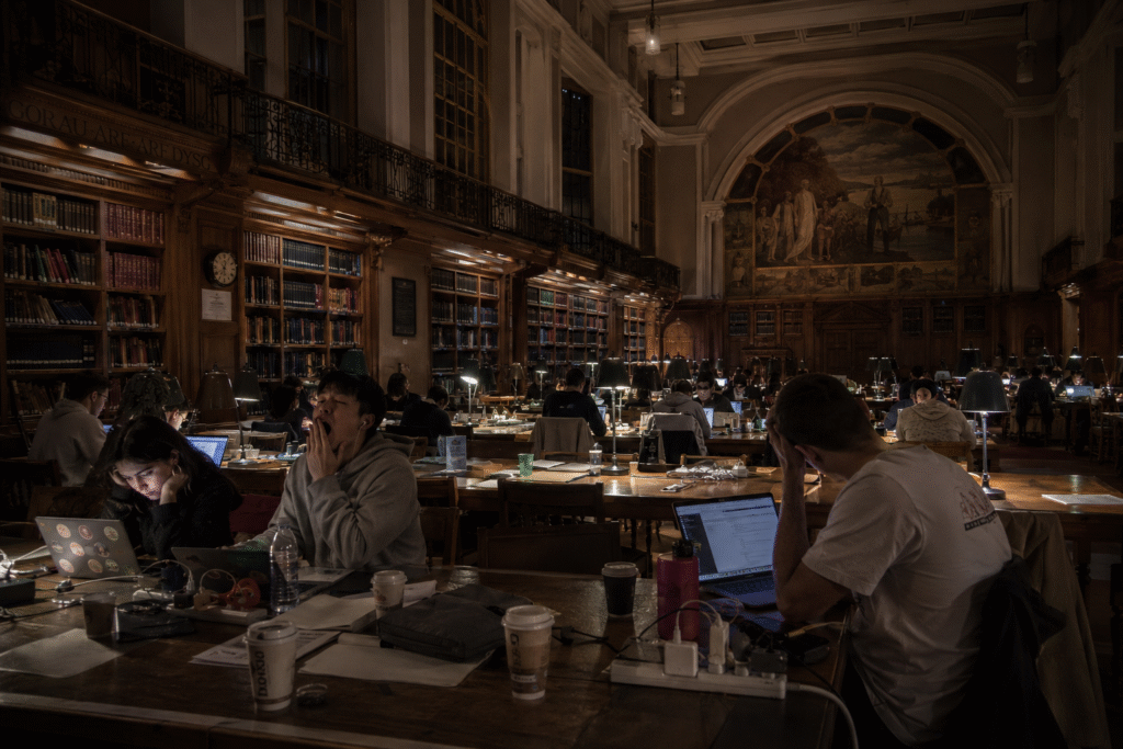  International students studying late at Cardiff University library during exam season
